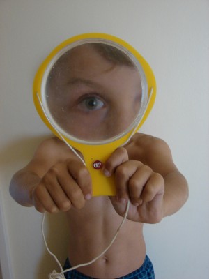 Boy with Yellow Magnifying Glass